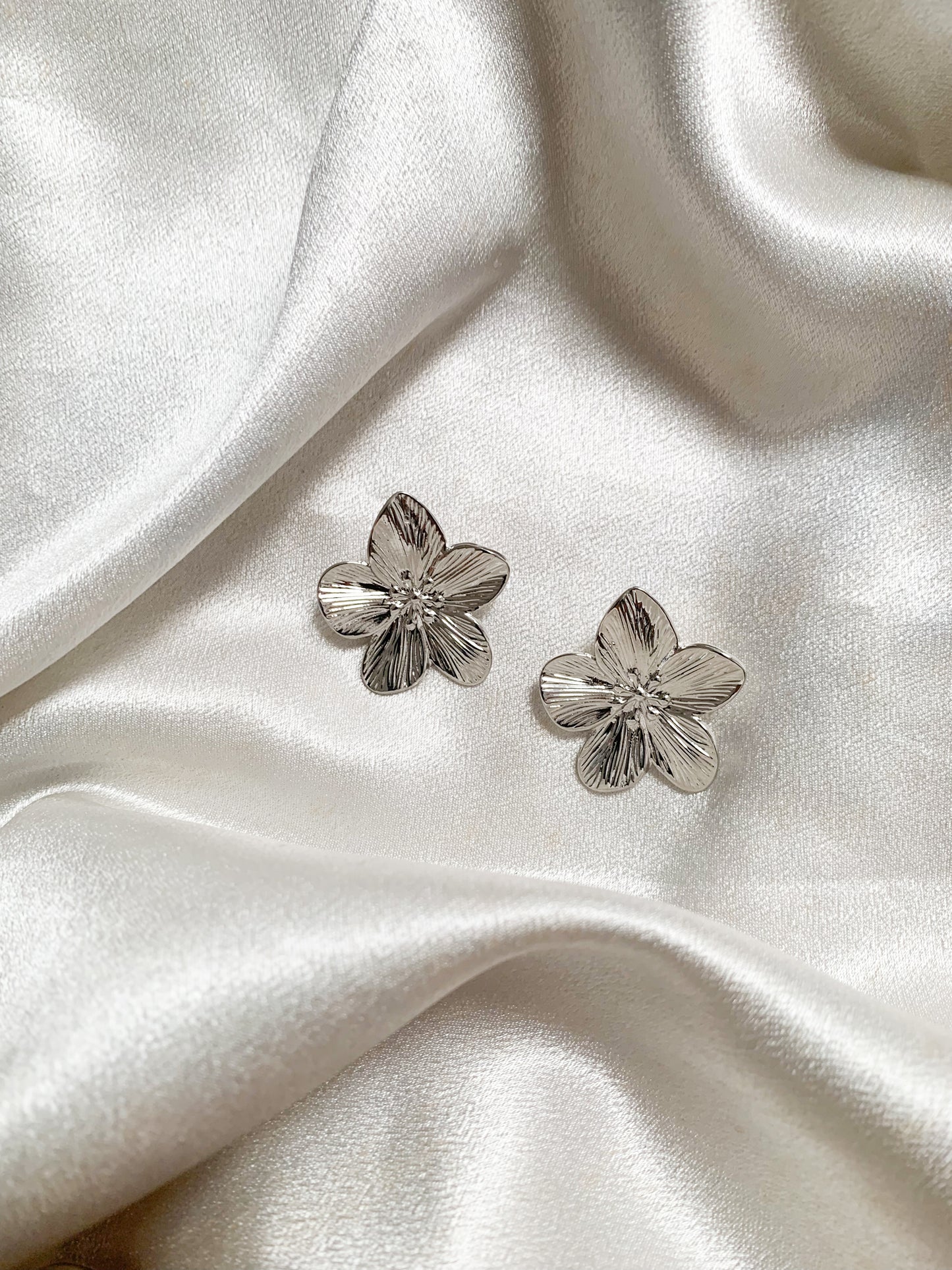 Dosetha silver floral earrings